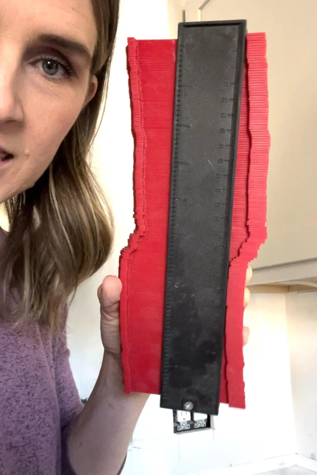 Using a contour gauge for kitchen remodel.